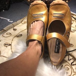 Flat gold Maryjanes.